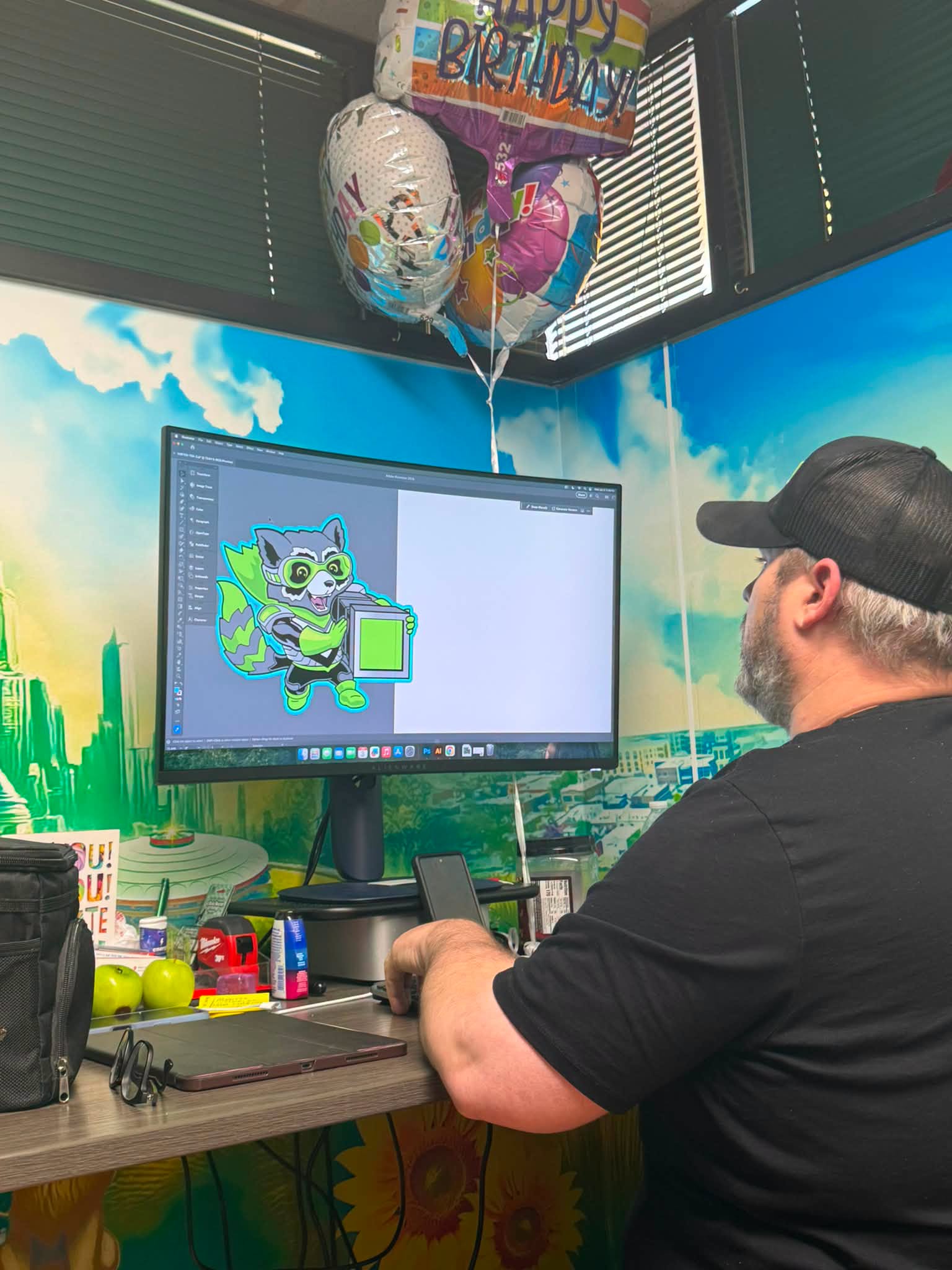 Designer working on a custom logo at Wichita Wrap Co