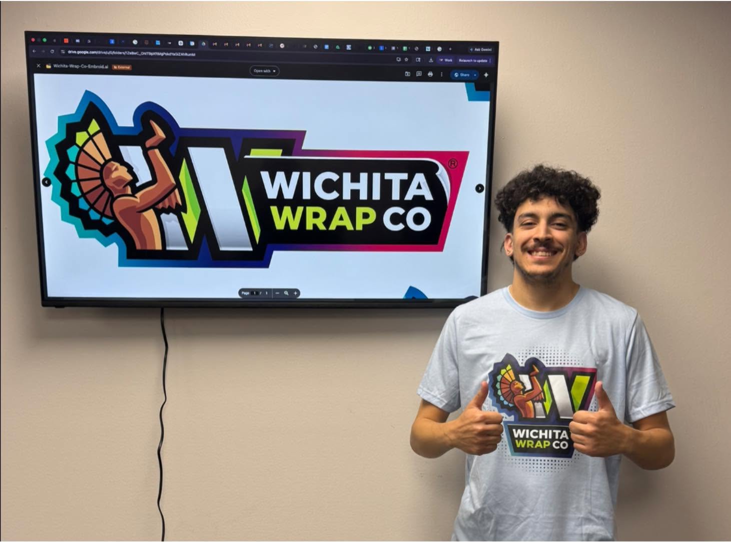 Team member wearing a custom Wichita Wrap Co shirt